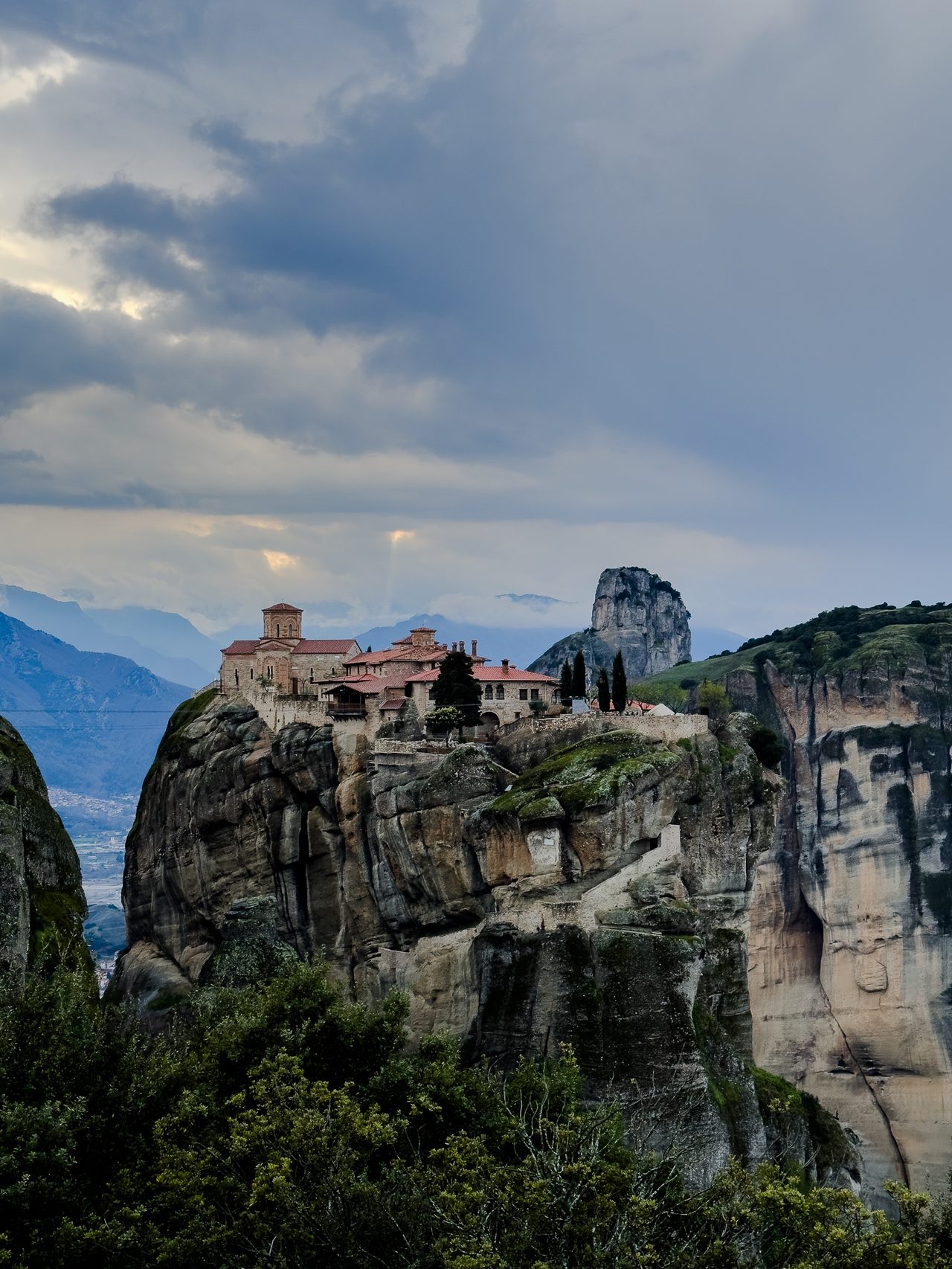 A clifftop monastery on a rugged sandstone tower, Meteora